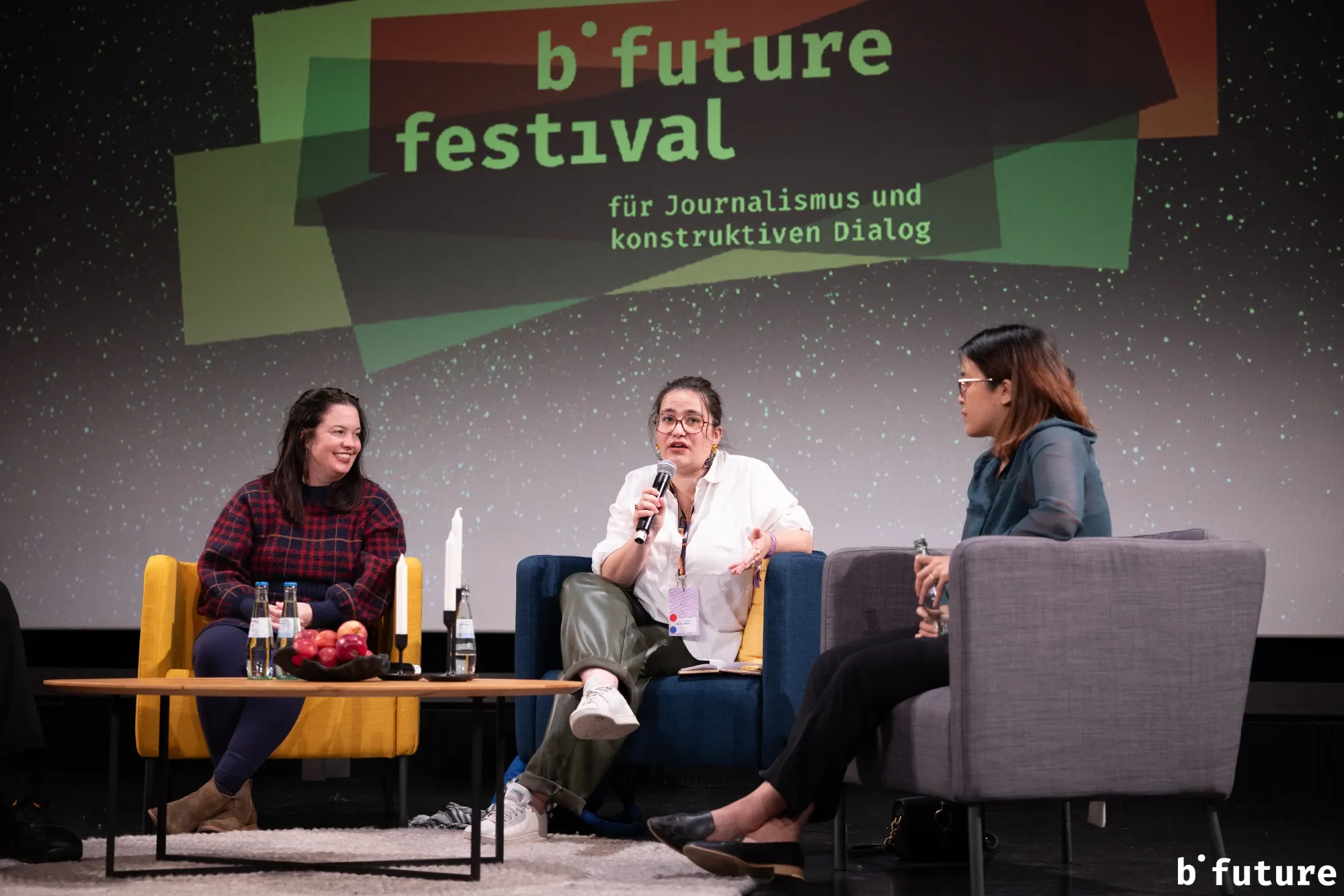 Méline Laffabry speaking on a panel at the b° future festival, between two other speakers